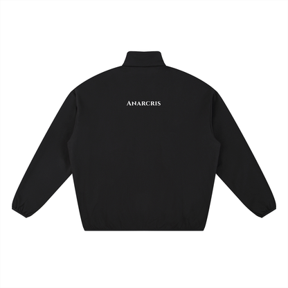 Black long-sleeve quarter-zip jacket with a mock neck collar, shown from the back. Features a small white stylized logo printed vertically on the upper back, displayed on a solid white background.